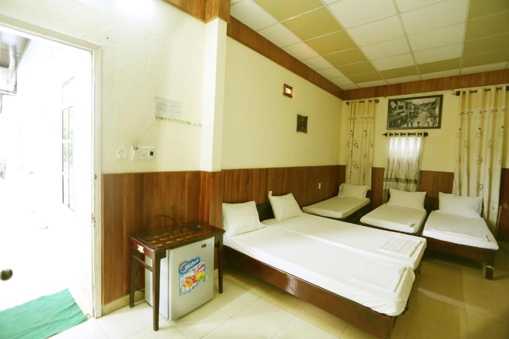 Postel nebo postele na pokoji v ubytování Homestay Hong Cong
