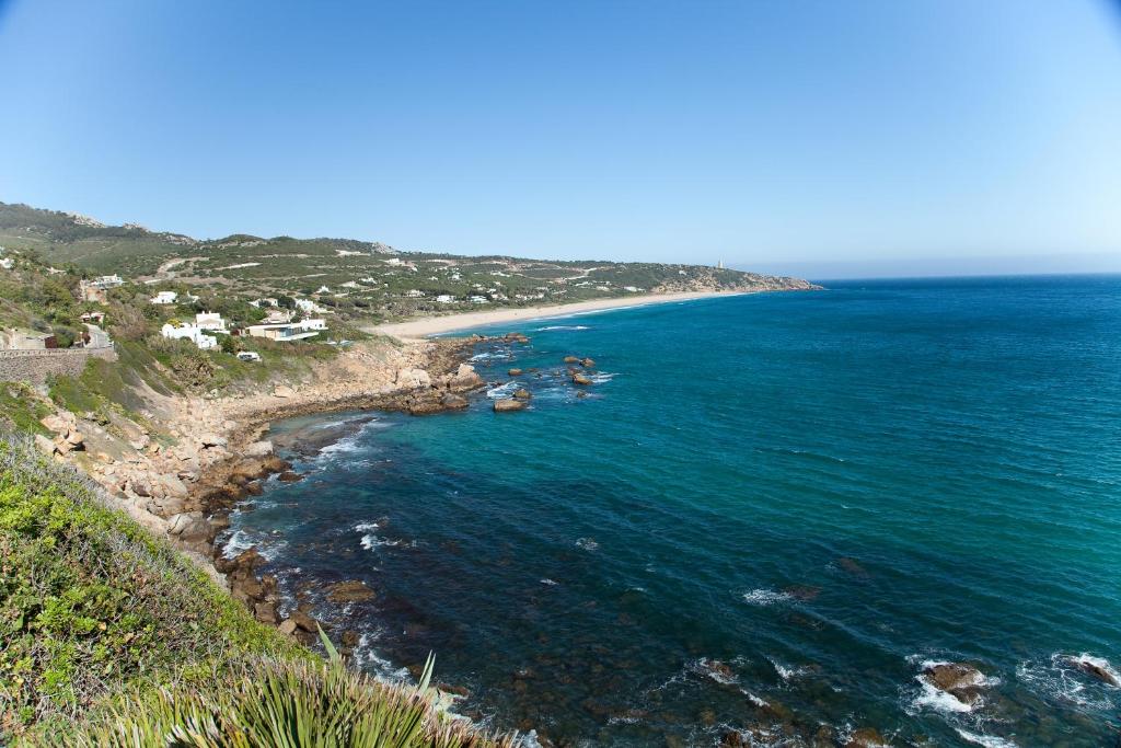 an aerial view of a beach and the ocean at Zahara Sol Villas y Apartamentos by QHotels in Zahara de los Atunes