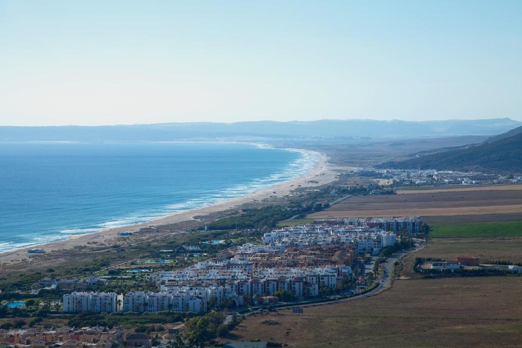 an aerial view of a beach and the ocean at Zahara Sol Villas y Apartamentos by QHotels in Zahara de los Atunes