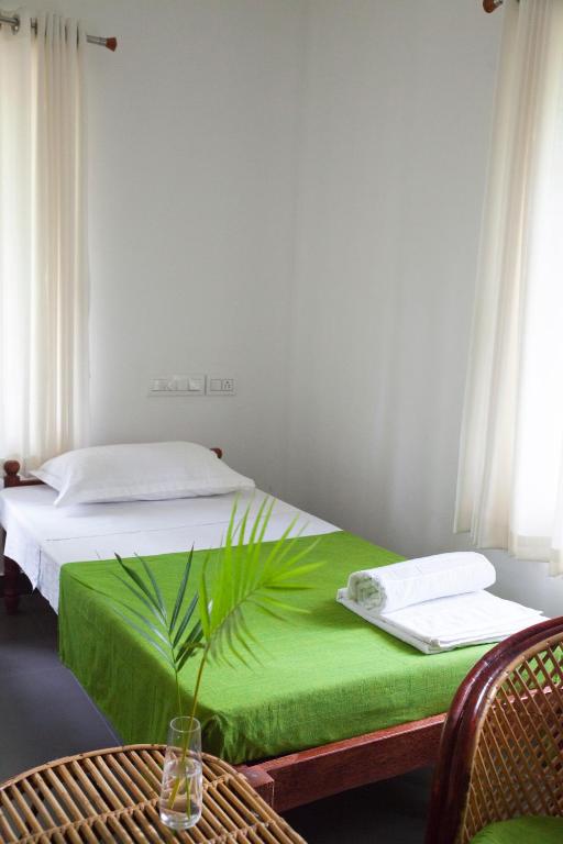 Postel nebo postele na pokoji v ubytování Mi Casa Tu Casa Homestay