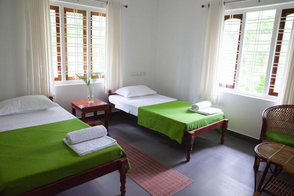 Postel nebo postele na pokoji v ubytování Mi Casa Tu Casa Homestay