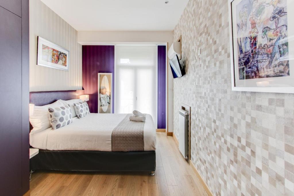 Postel nebo postele na pokoji v ubytování Hôtel Provençal
