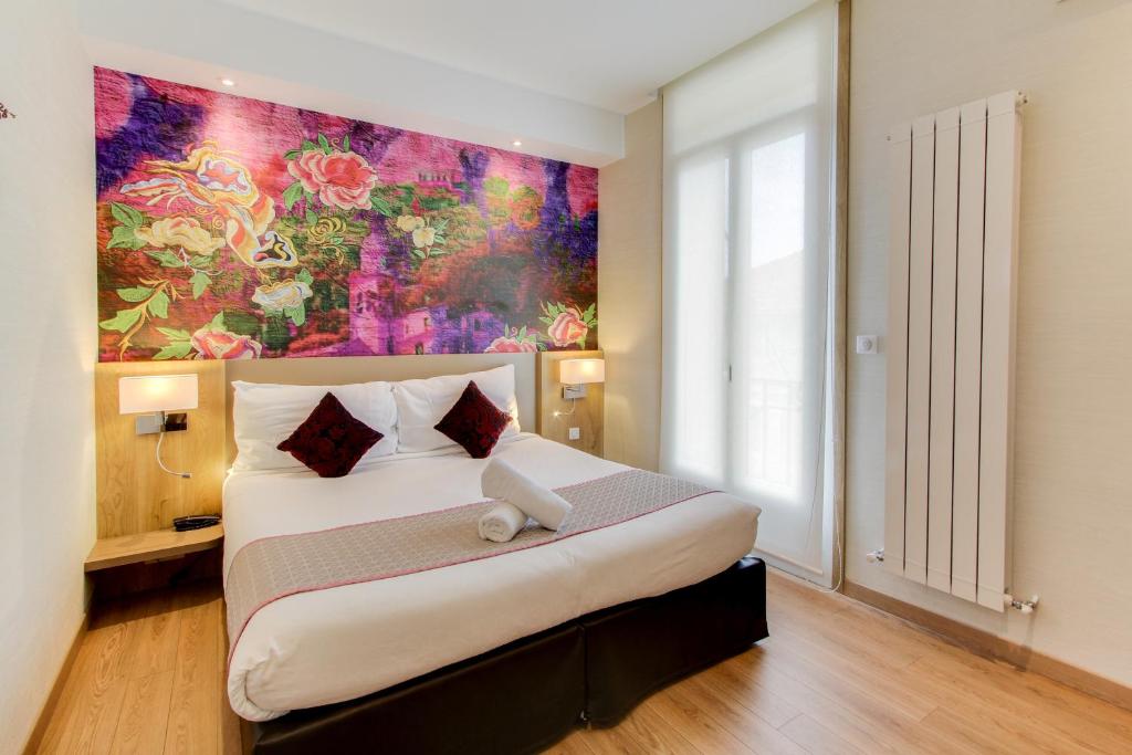Postel nebo postele na pokoji v ubytování Hôtel Provençal