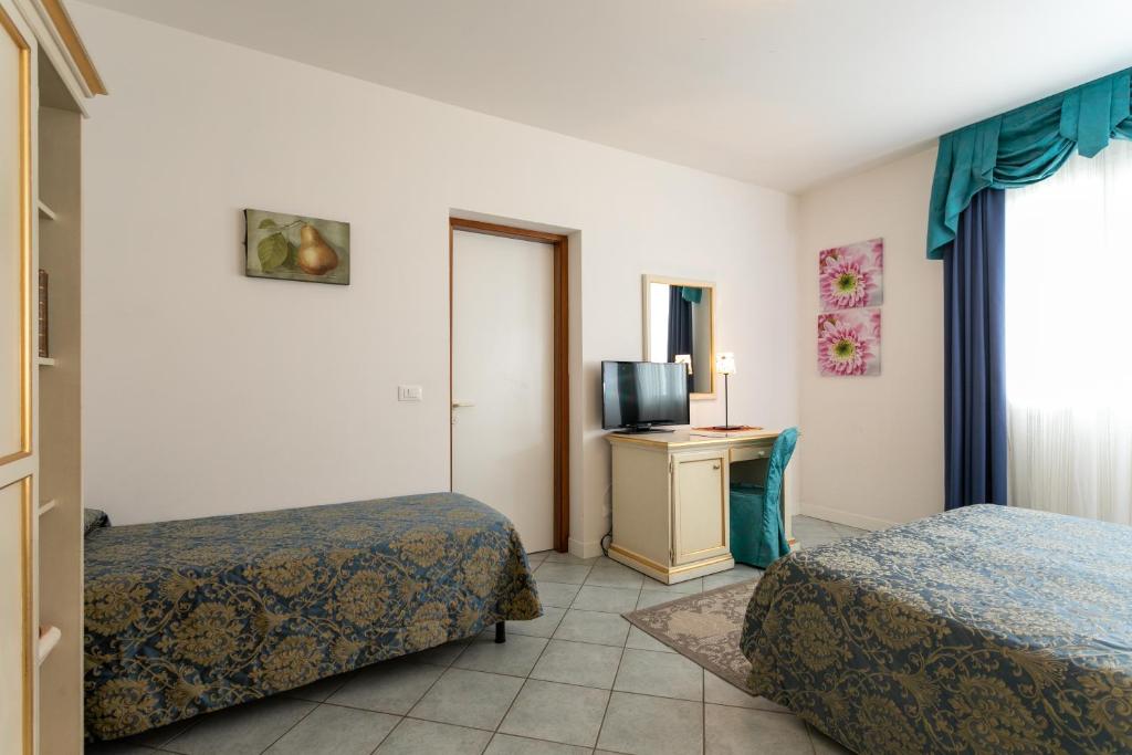 Postel nebo postele na pokoji v ubytování Hotel Elpiro