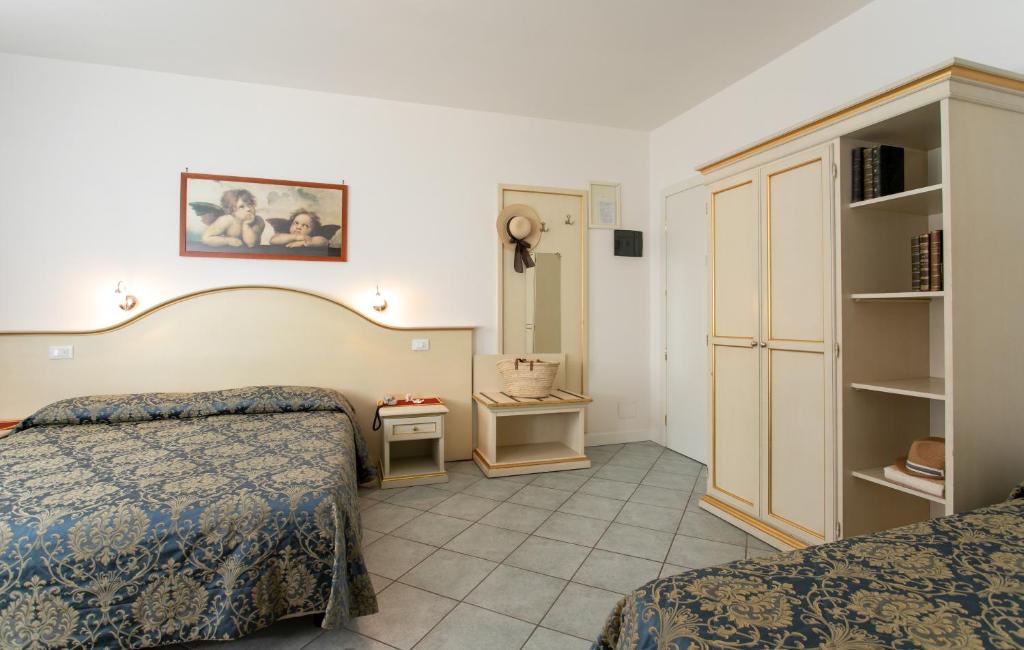 Postel nebo postele na pokoji v ubytování Hotel Elpiro