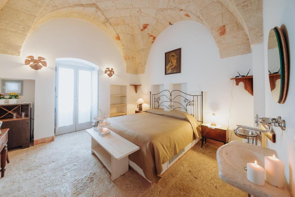 A bed or beds in a room at Masseria Ancella