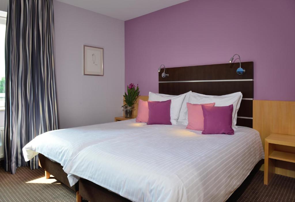 Postel nebo postele na pokoji v ubytování Hotel Uhu Garni - Superior