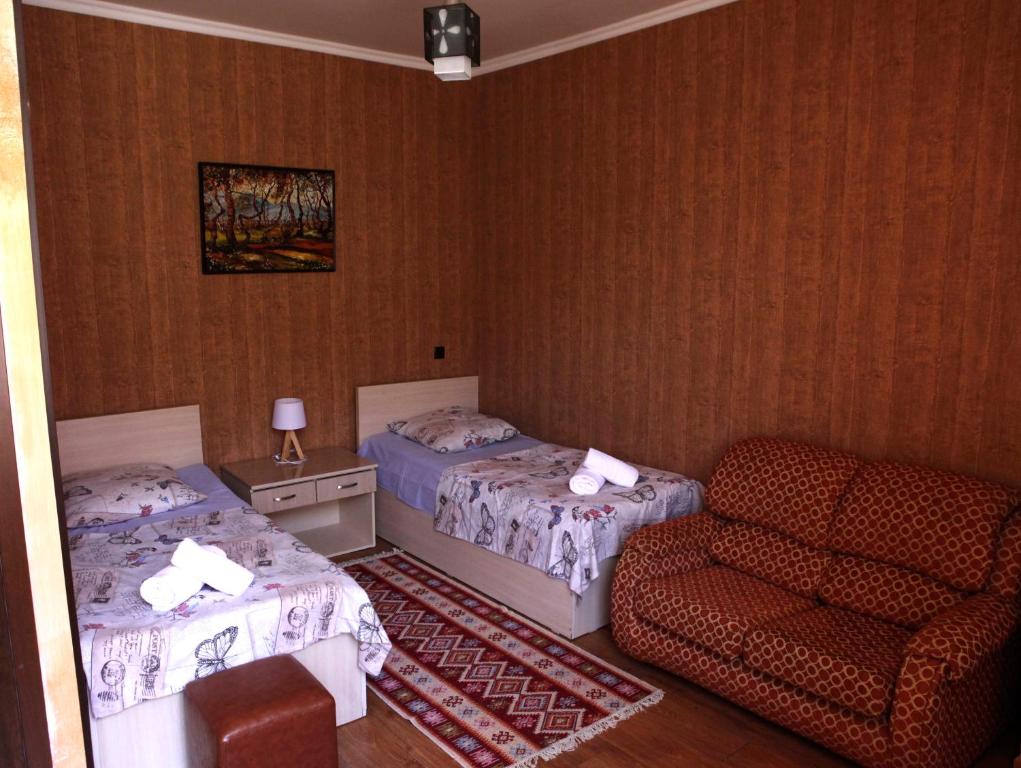 Postel nebo postele na pokoji v ubytování Family Mini-Hotel Martirosyan's and tours