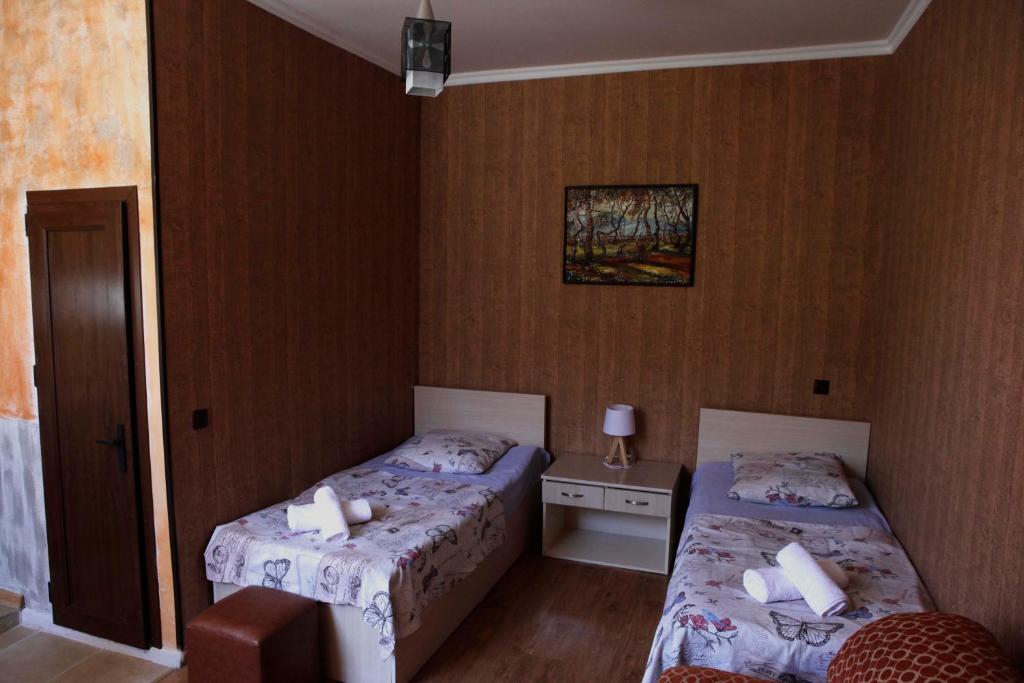 Postel nebo postele na pokoji v ubytování Family Mini-Hotel Martirosyan's and tours