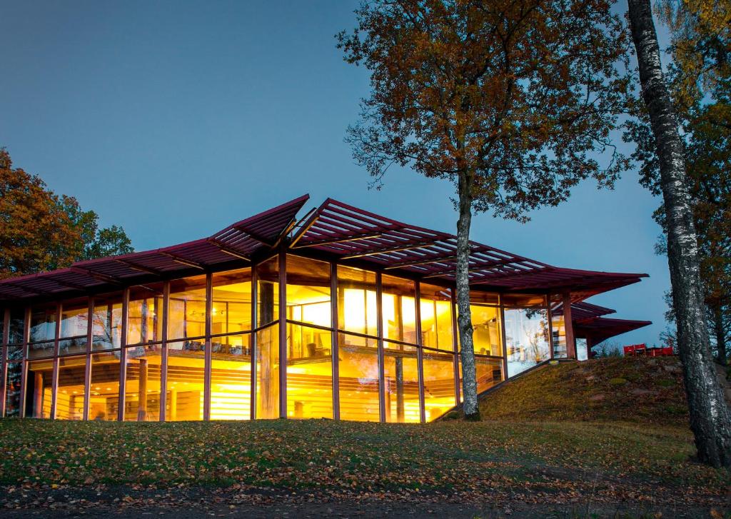 a glass house with a tree in front of it at Öijared Resort in Floda