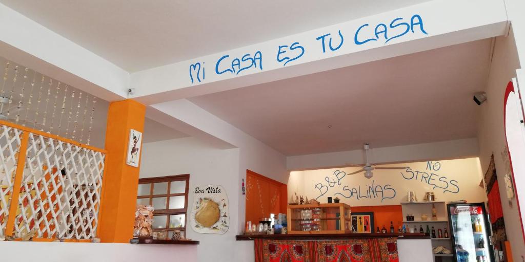 a room with a sign that reads my gas is to caza at B&B Salinas Boa Vista WiFi FREE in Sal Rei