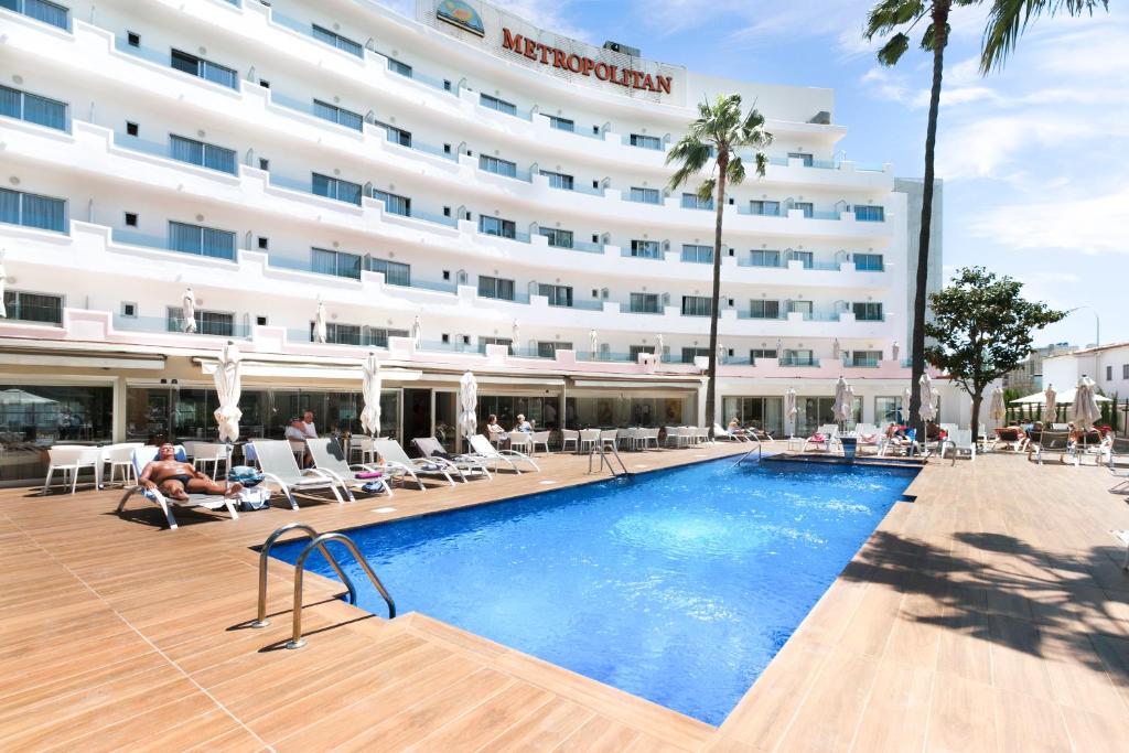 a hotel with a swimming pool in front of a building at Hotel Metropolitan Playa 3 Sup in Playa de Palma