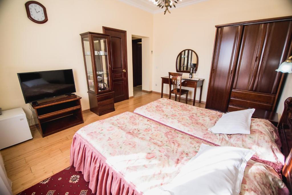 Postel nebo postele na pokoji v ubytování Hotel Sofia