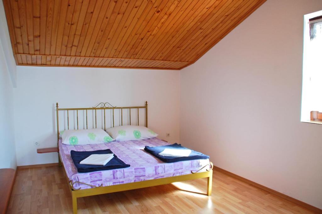 Łóżko lub łóżka w pokoju w obiekcie Apartments Miro