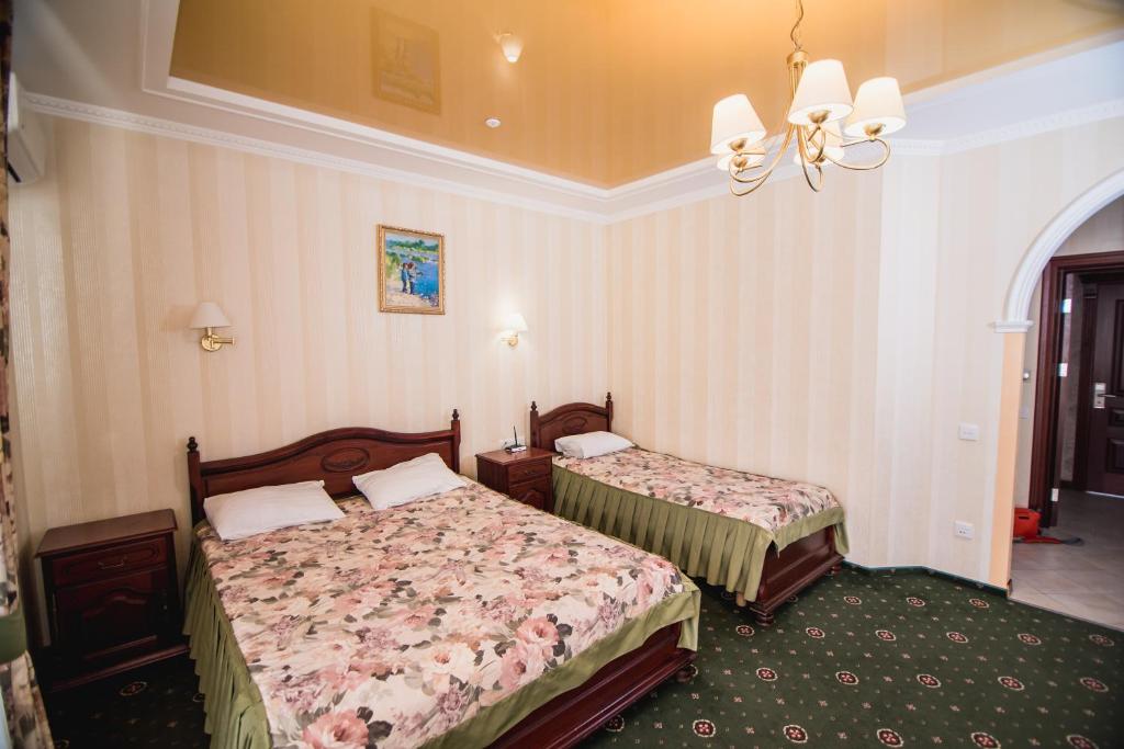 Postel nebo postele na pokoji v ubytování Hotel Sofia