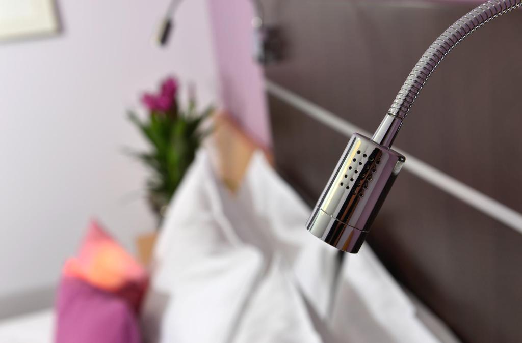 Postel nebo postele na pokoji v ubytování Hotel Uhu Garni - Superior