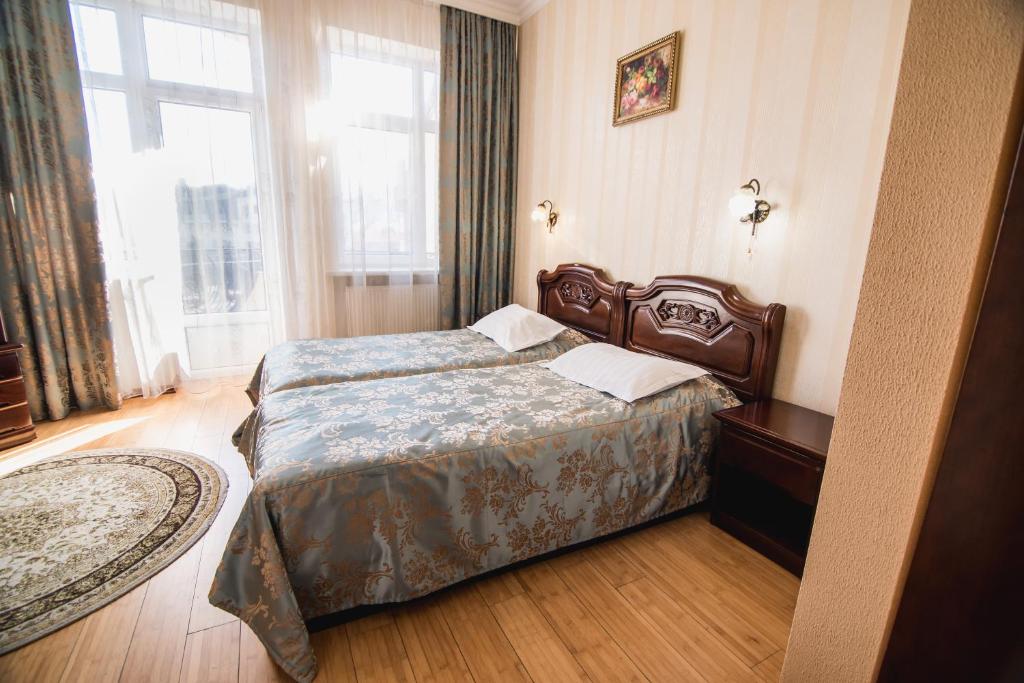 Postel nebo postele na pokoji v ubytování Hotel Sofia