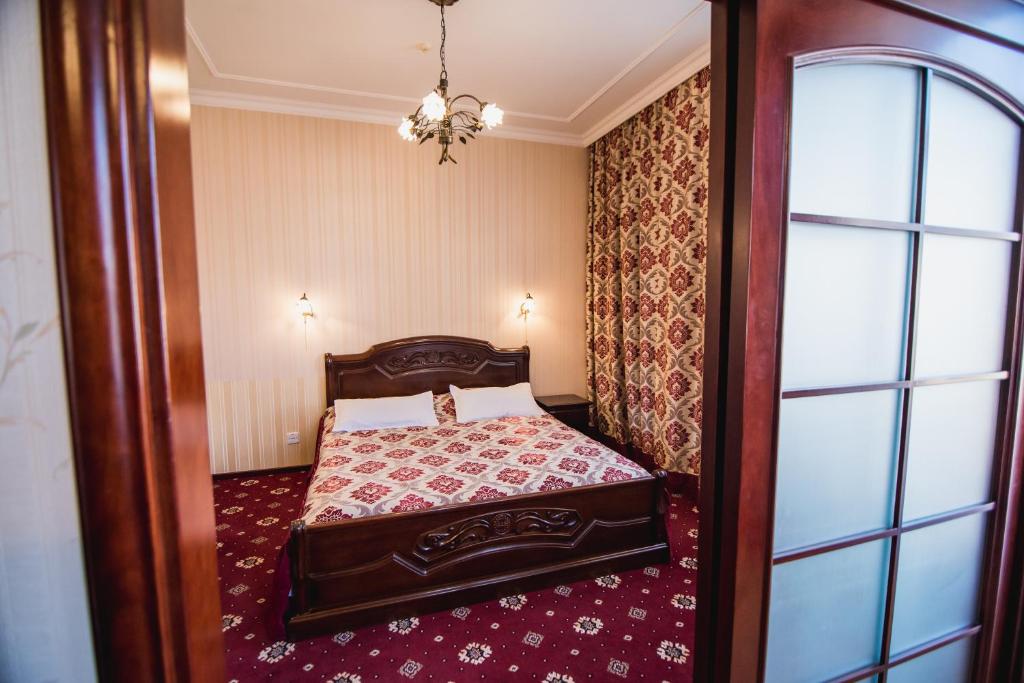 Postel nebo postele na pokoji v ubytování Hotel Sofia