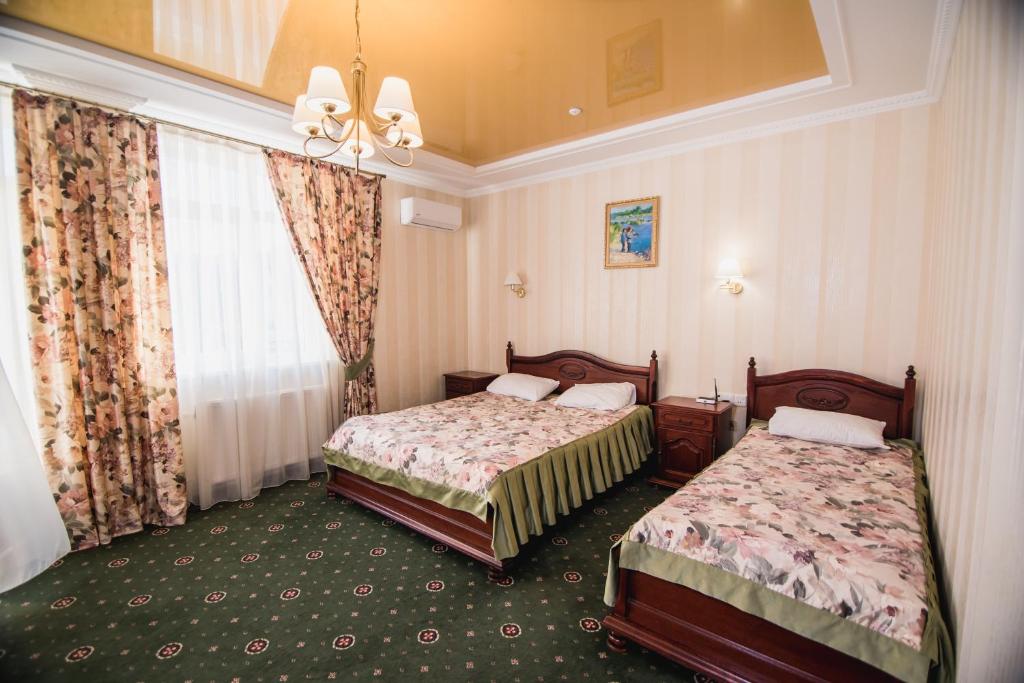 Postel nebo postele na pokoji v ubytování Hotel Sofia