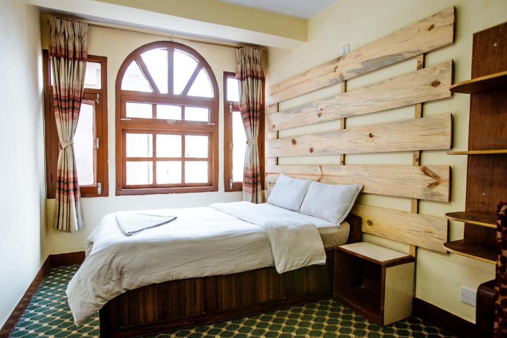 Postel nebo postele na pokoji v ubytování Hotel Pomelo House