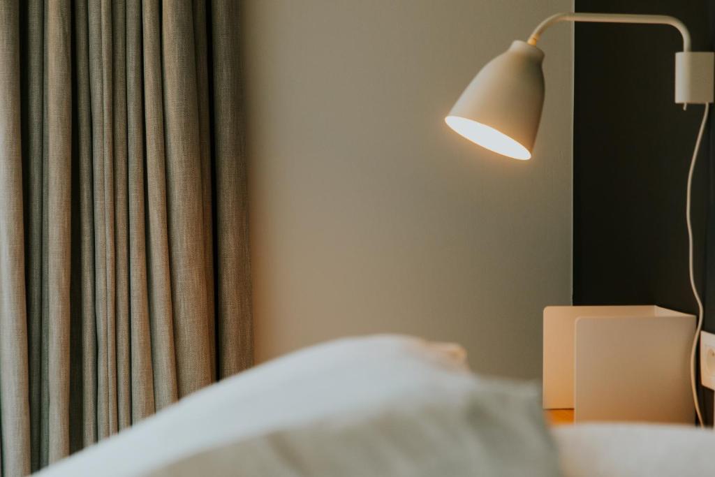 Postel nebo postele na pokoji v ubytování Hotel Jerom