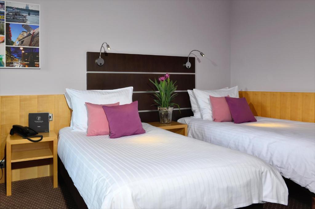 Postel nebo postele na pokoji v ubytování Hotel Uhu Garni - Superior
