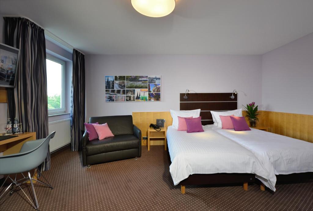 Postel nebo postele na pokoji v ubytování Hotel Uhu Garni - Superior