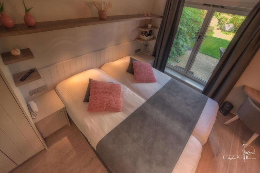 Postel nebo postele na pokoji v ubytování Hotel Bilderdijk