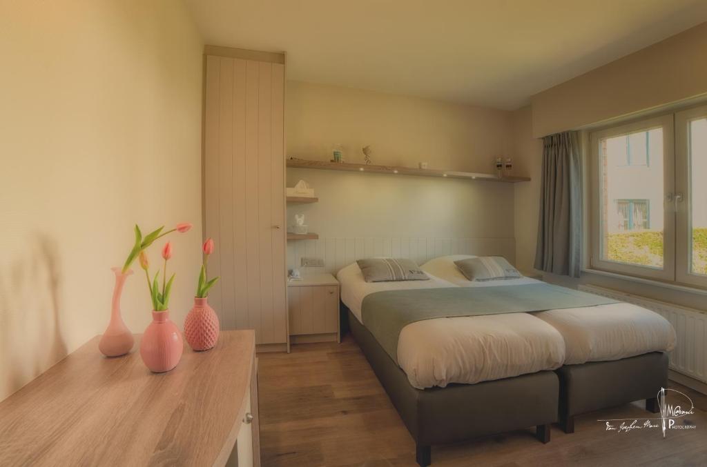 Postel nebo postele na pokoji v ubytování Hotel Bilderdijk