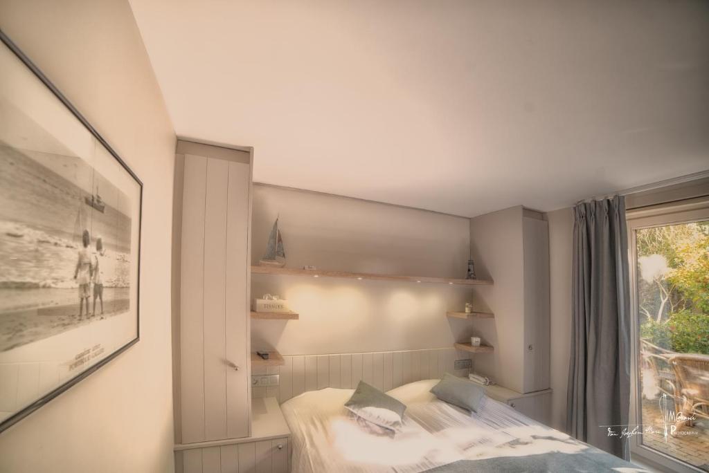 Postel nebo postele na pokoji v ubytování Hotel Bilderdijk