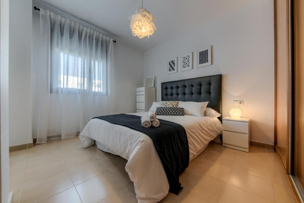 Posteľ alebo postele v izbe v ubytovaní Apartamento Daniel