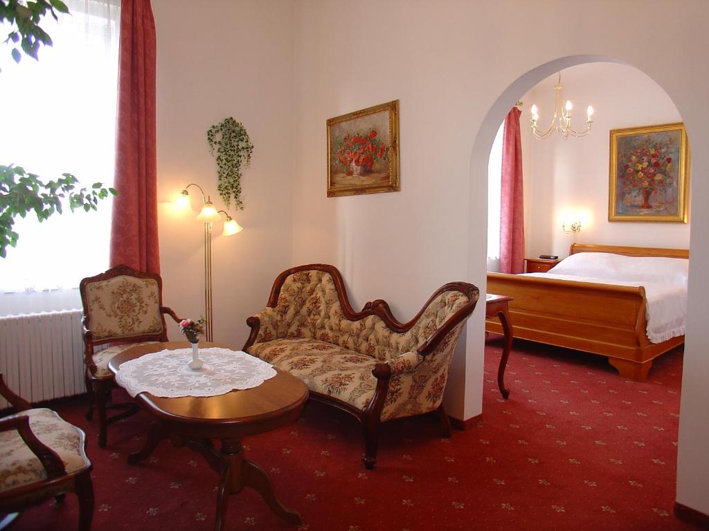 Postel nebo postele na pokoji v ubytování Hotel Opera