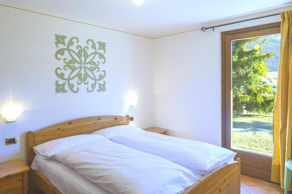 Letto o letti in una camera di Residence Bait da Mott