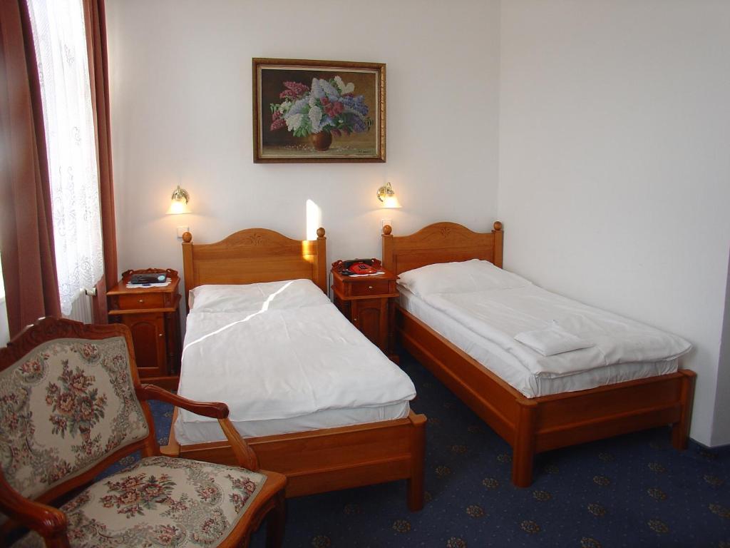 Postel nebo postele na pokoji v ubytování Hotel Opera