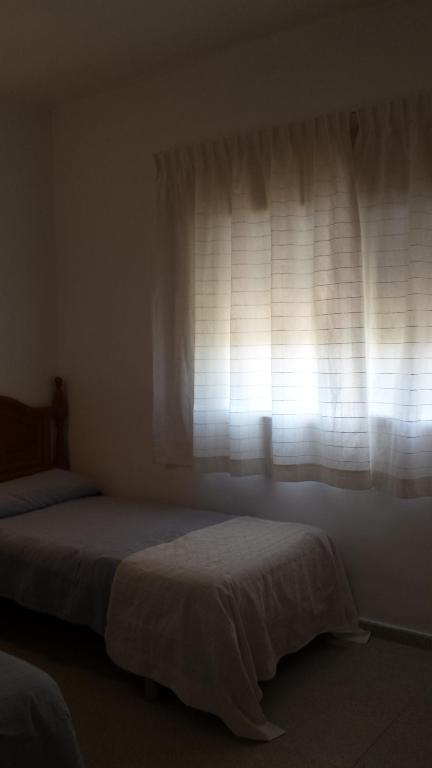 Postel nebo postele na pokoji v ubytování Casa Algaida