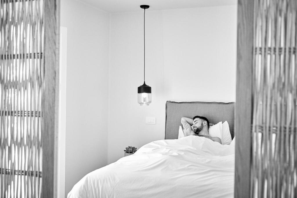 Postel nebo postele na pokoji v ubytování Boho Private Luxury Suites