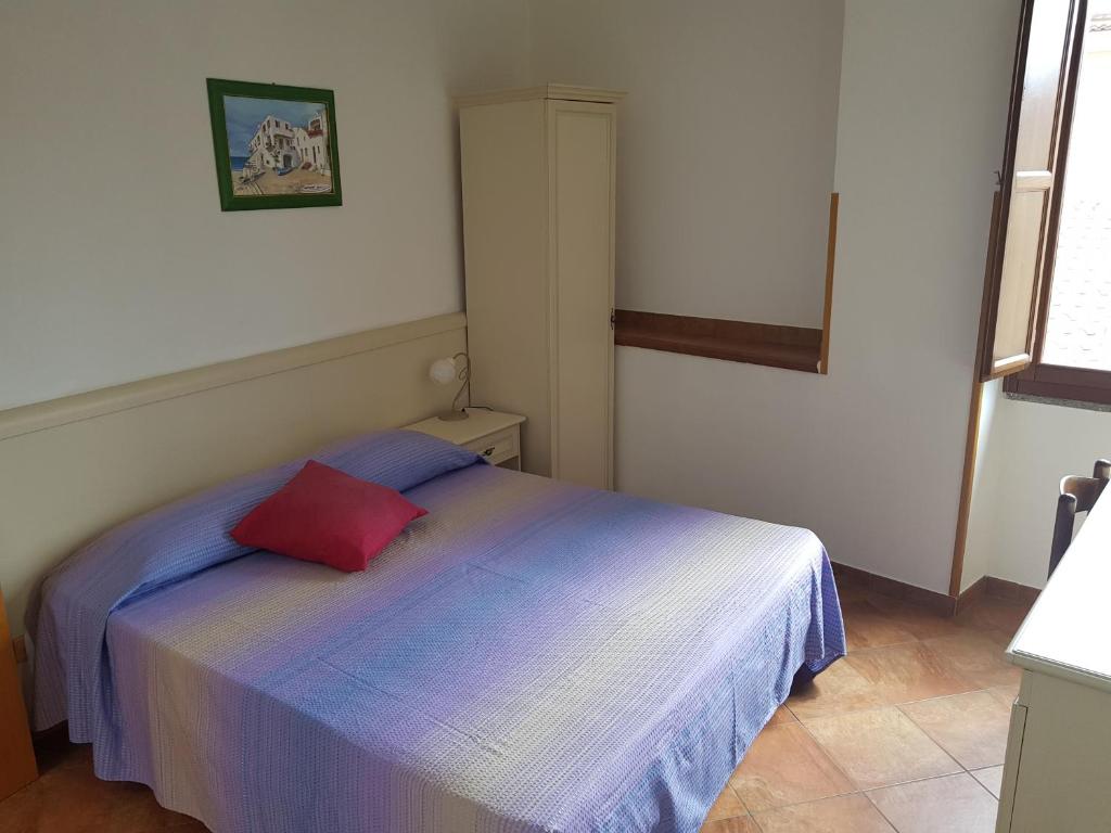 Postel nebo postele na pokoji v ubytování Locanda Aria del Re