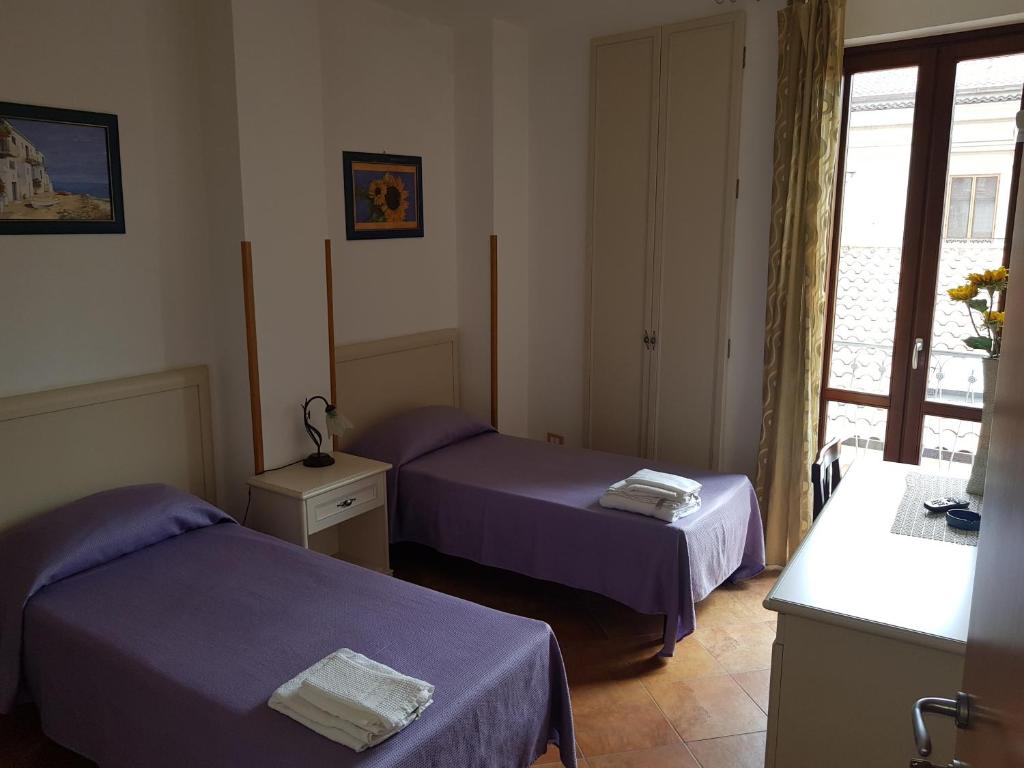 Postel nebo postele na pokoji v ubytování Locanda Aria del Re