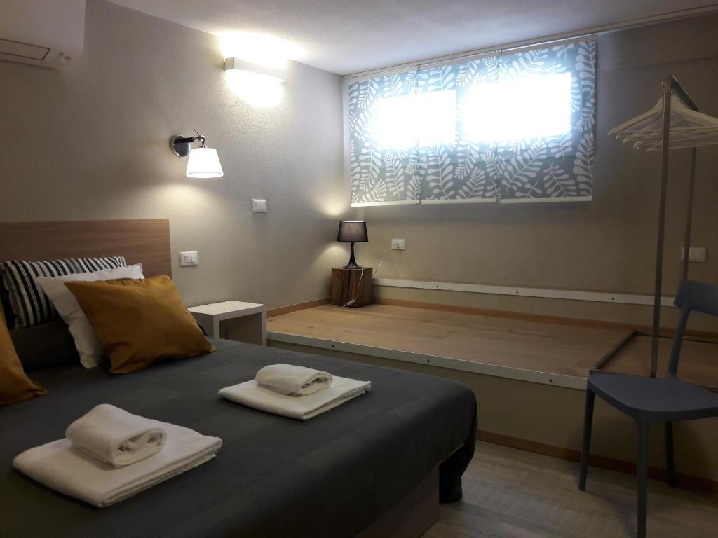 Łóżko lub łóżka w pokoju w obiekcie Santa Marta Rooms - Vernazza