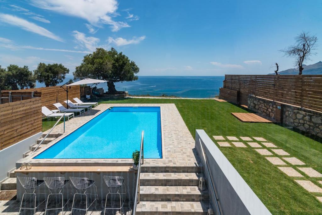 a swimming pool on the side of a house at VΙLLA ANNA-MARIA in Zakynthos Town