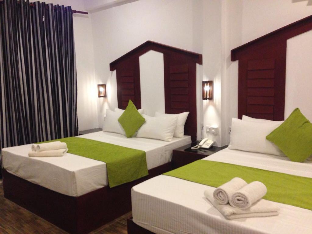 Postel nebo postele na pokoji v ubytování Sunshine Resort & Spa Sigiriya