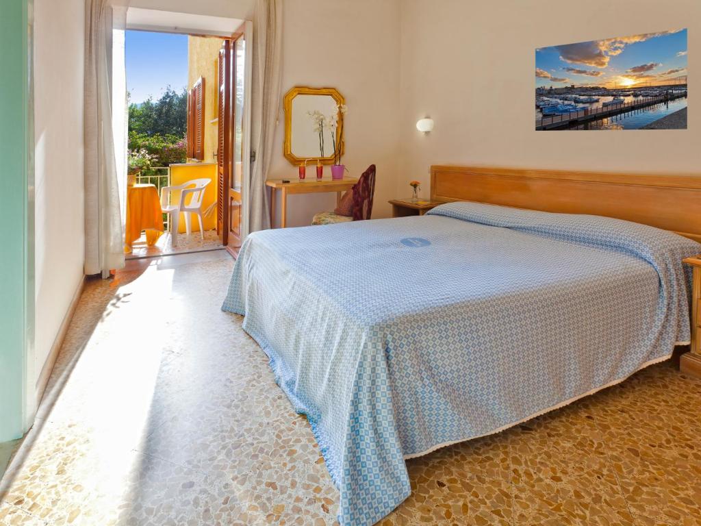 Postel nebo postele na pokoji v ubytování Hotel Cleopatra