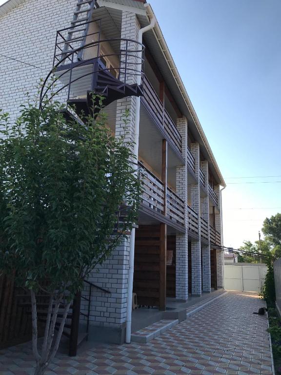 a building with a staircase on the side of it at Mini-hotel Zefir in Zatoka