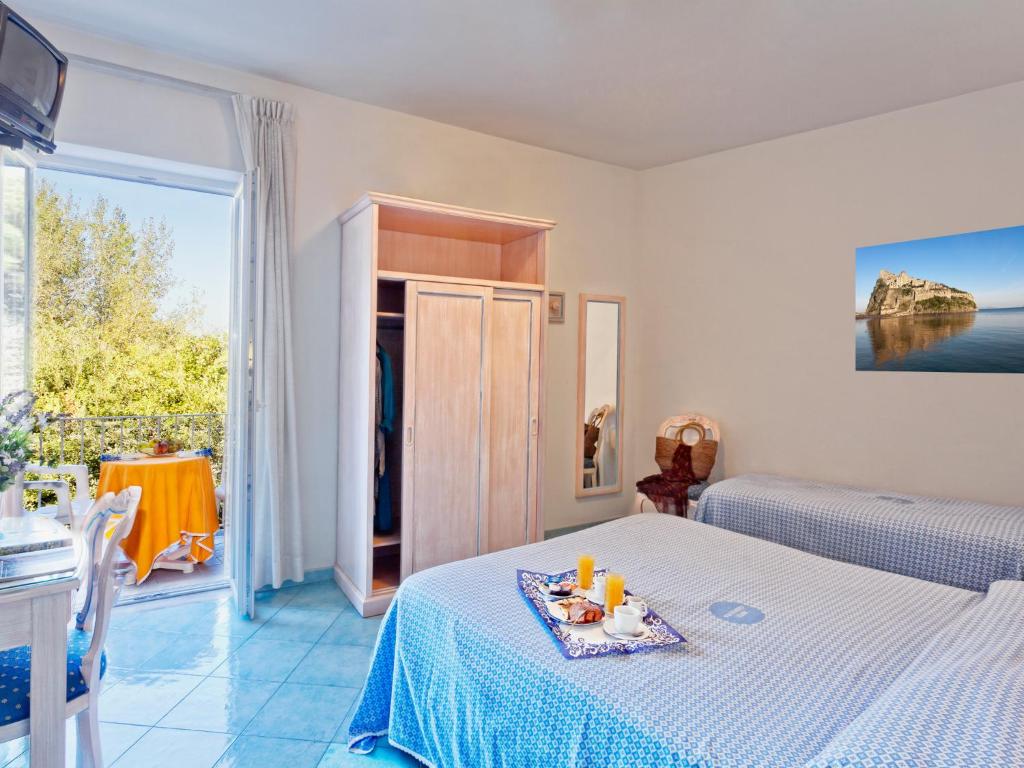 Postel nebo postele na pokoji v ubytování Hotel Cleopatra