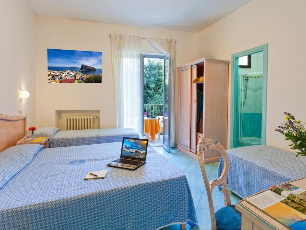 Postel nebo postele na pokoji v ubytování Hotel Cleopatra