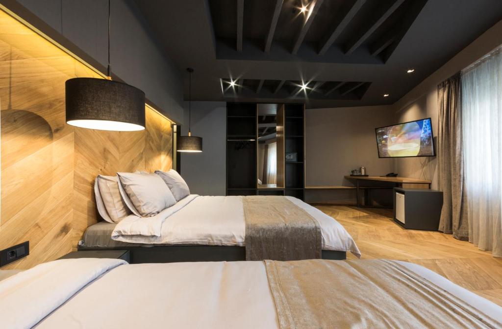 Postel nebo postele na pokoji v ubytování Hotel London B&B