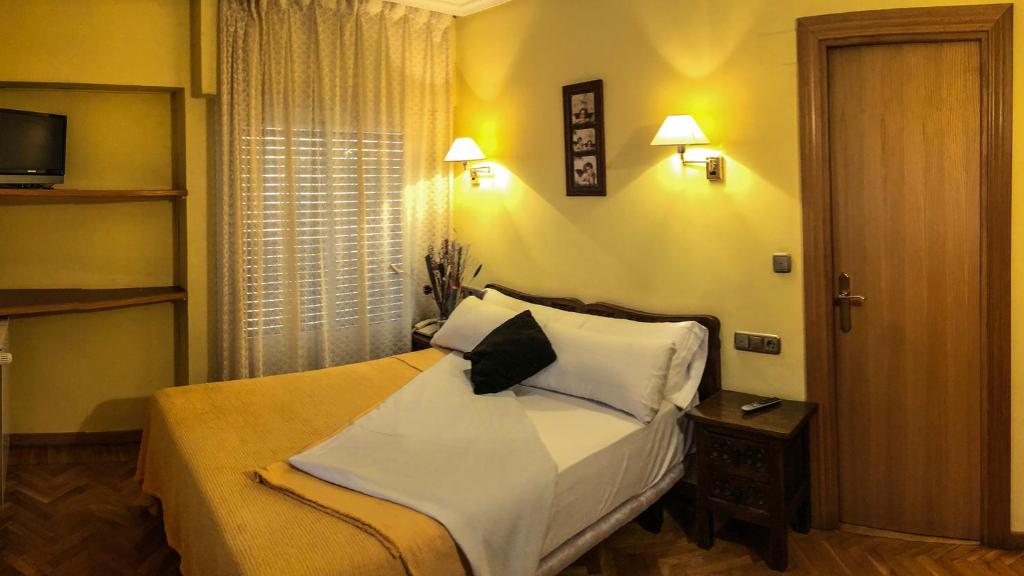 Postel nebo postele na pokoji v ubytování Hotel A Nieu