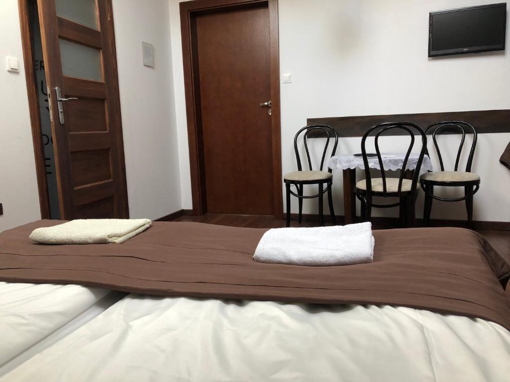 Posteľ alebo postele v izbe v ubytovaní Apartamenty i Pokoje Na Letniej