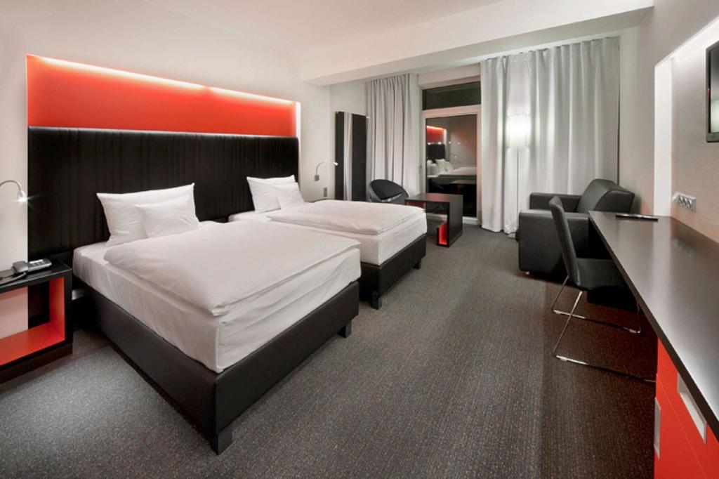 Postel nebo postele na pokoji v ubytování Sport & Relax Hotel Davidek