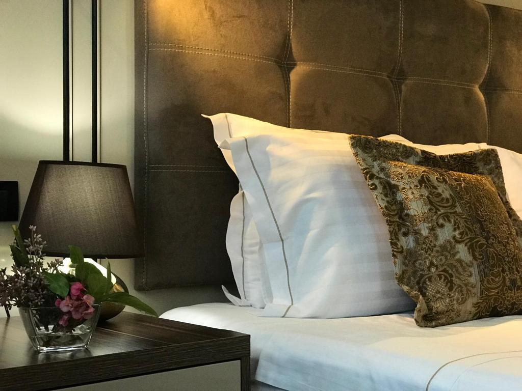 Postel nebo postele na pokoji v ubytování Hotel Deluxe